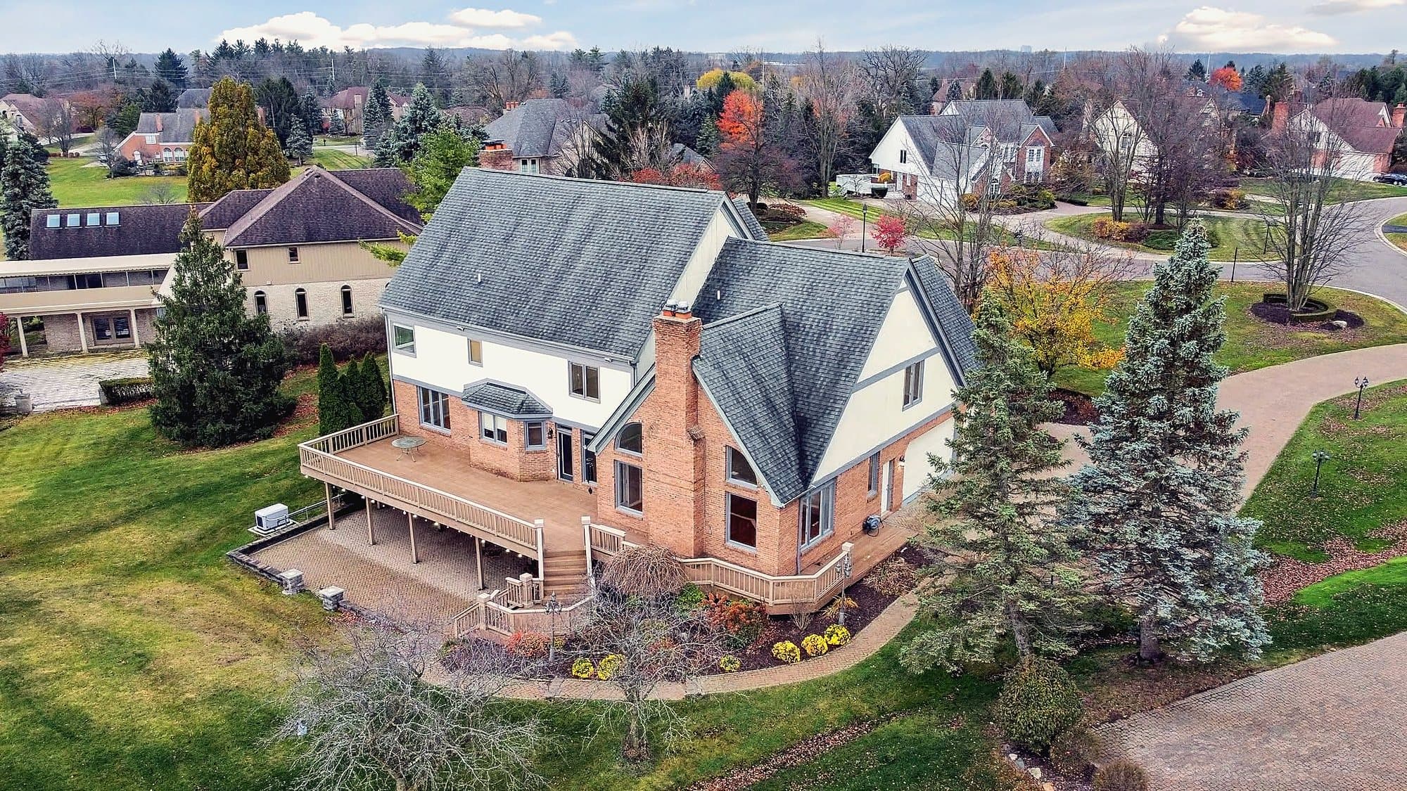 Aerial view of a home in an established neighborhood