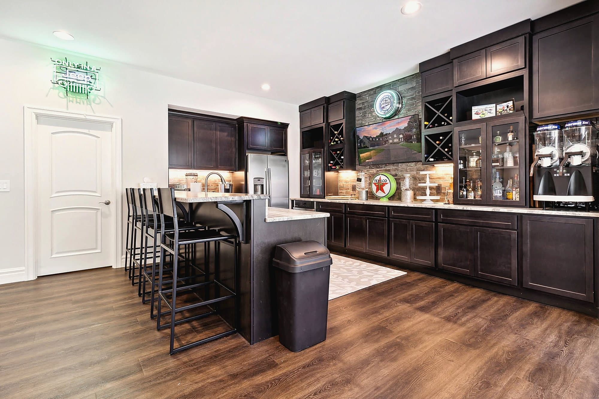 Updated kitchen with dark cabinetry and island seating