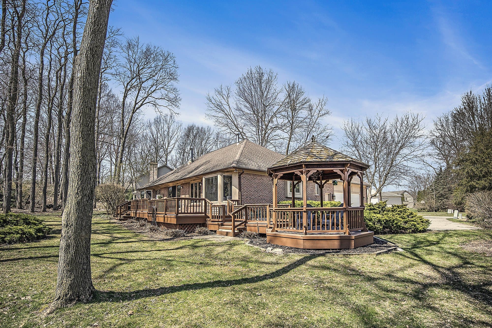 Lakeside gazebo among mature trees