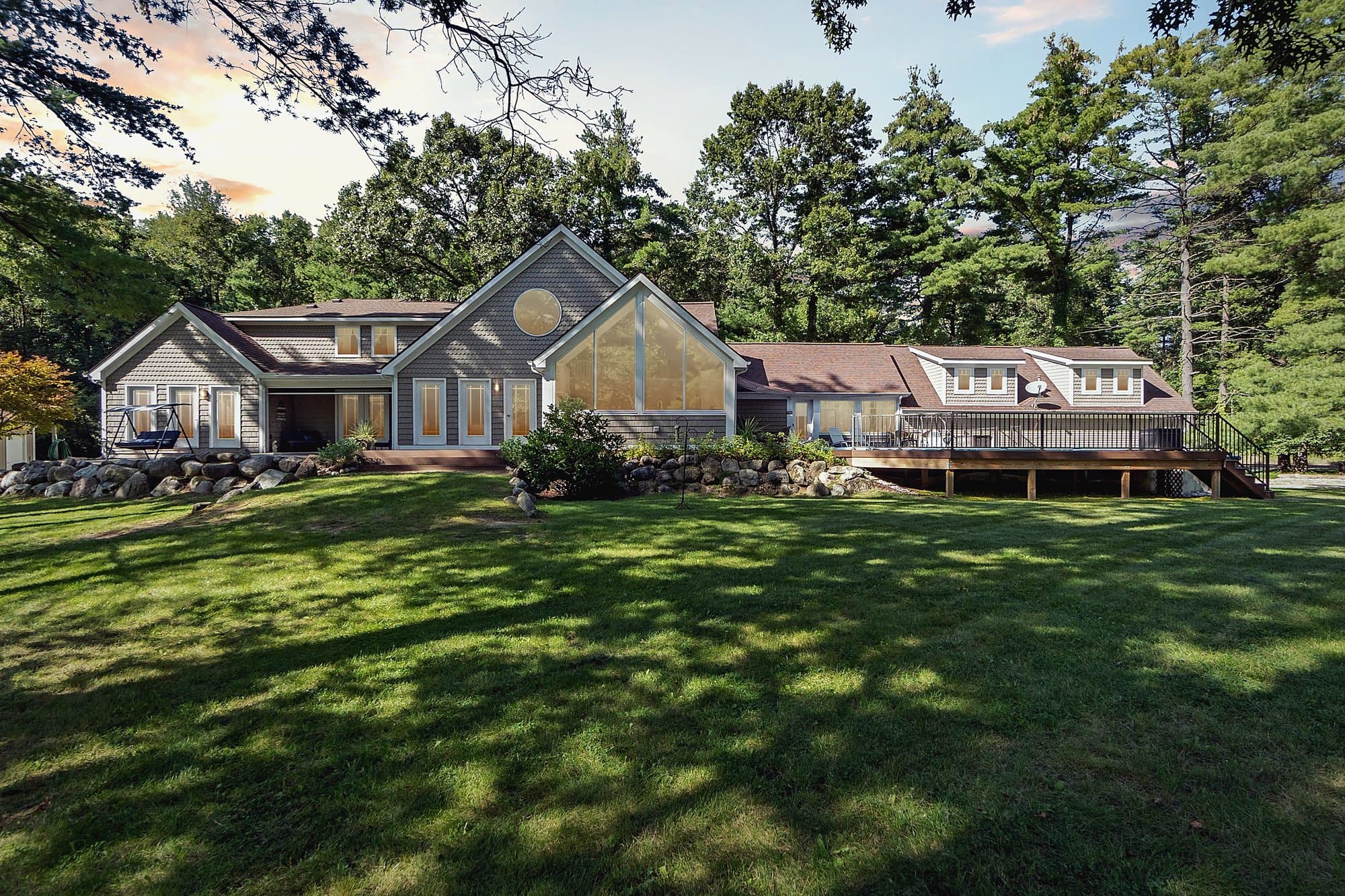 Home with a wide green lawn in Southeast Michigan